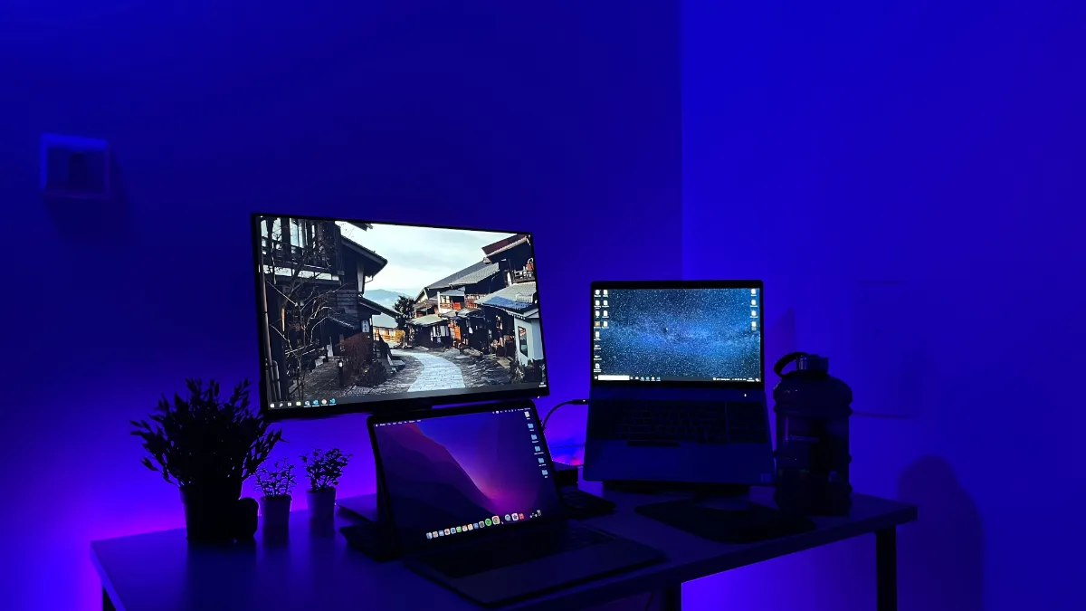A desktop monitor playing high-definition video with a playlist open beside it
